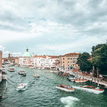 Boats floating on canal in old town